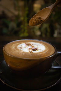 Close-up of cappuccino on table