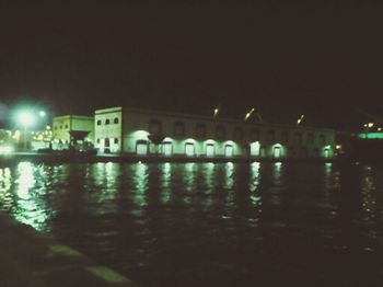 Reflection of illuminated buildings in water at night