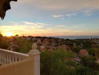 High angle view of townscape against sky at sunset