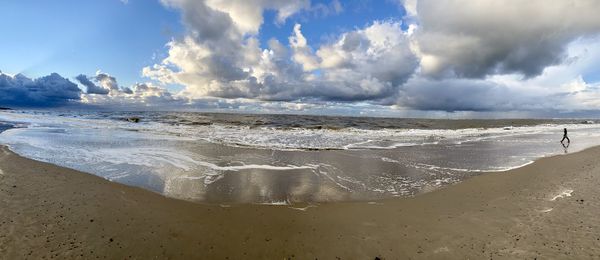 Panoramic view of beach against sky