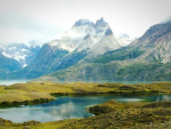 Scenic view of lake with mountains in background