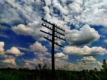 Low angle view of communications tower against sky