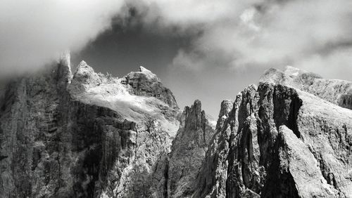 Scenic view of mountains against cloudy sky