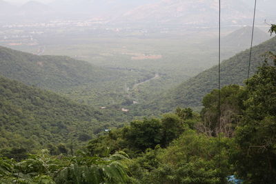 High angle view of landscape and mountains in foggy weather