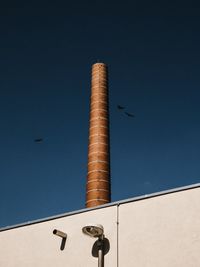 Low angle view of building against blue sky