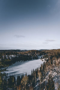 Scenic view of frozen lake against sky