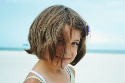 Close-up portrait of girl on the beach