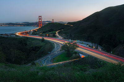 High angle view of light trails on road against sky