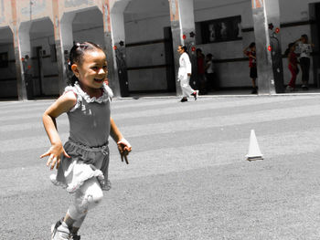 People running on road in city