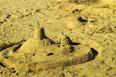 High angle view of footprints on sand