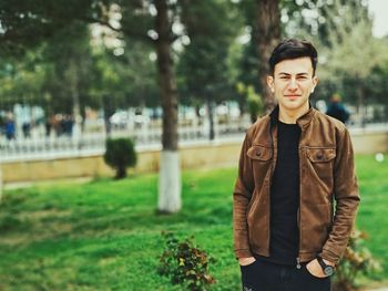 Portrait of young man standing outdoors