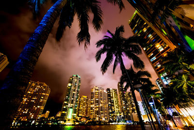 Low angle view of modern building against sky at night