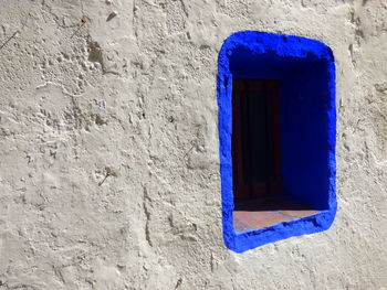 Blue window on wall