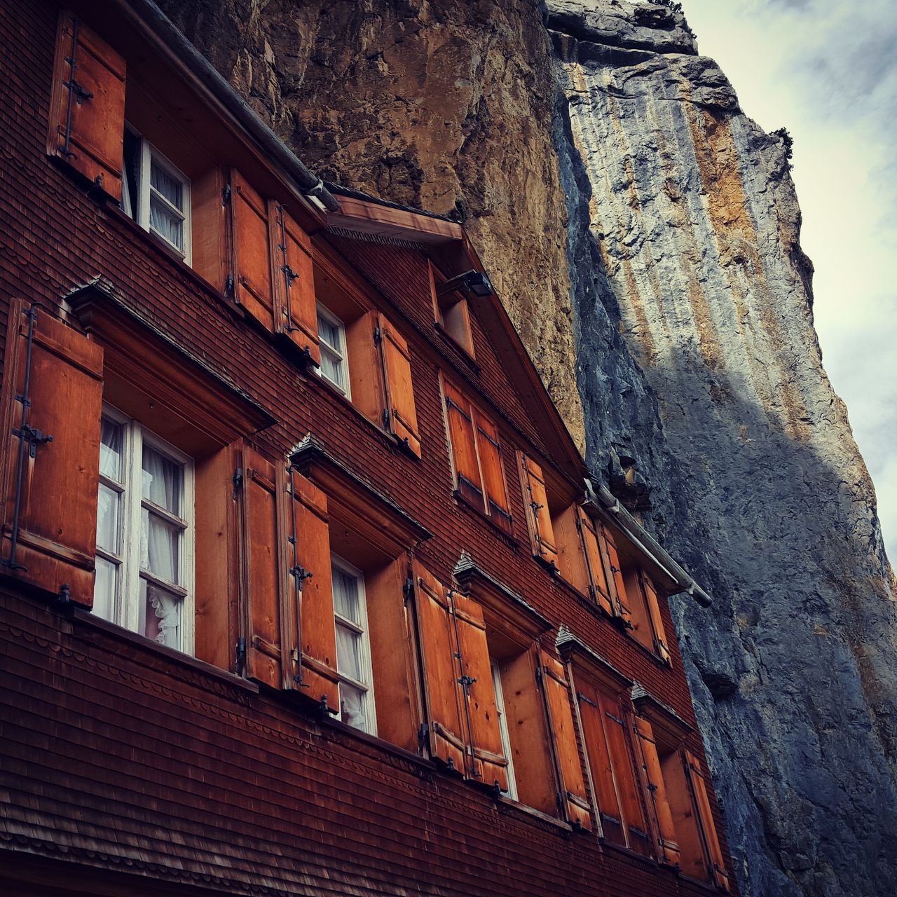 architecture, building exterior, built structure, low angle view, sky, history, building, old, window, outdoors, day, wall - building feature, residential building, no people, cloud - sky, residential structure, city, brick wall, historic, travel destinations