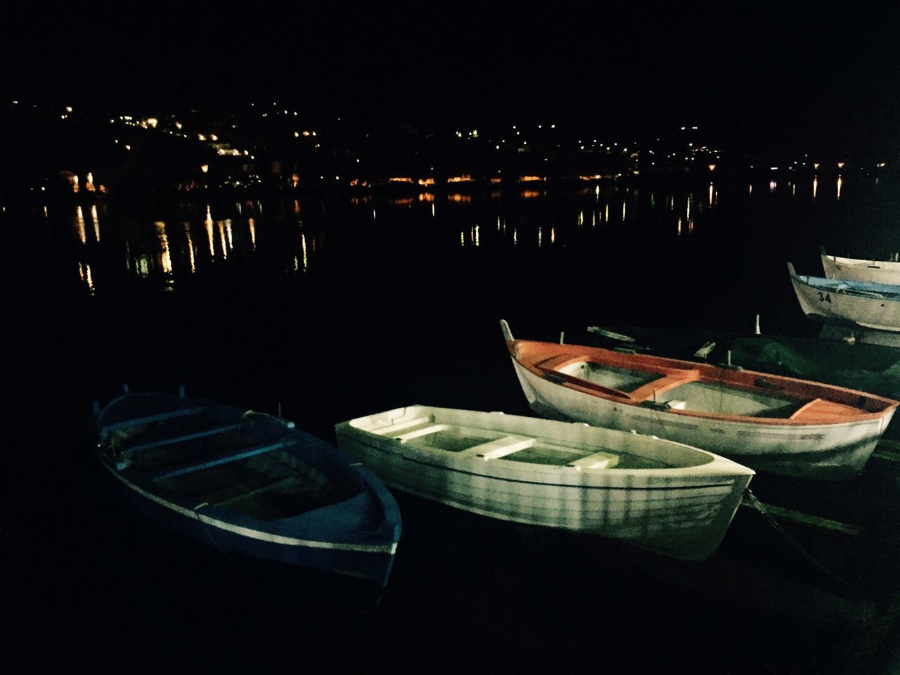 water, nautical vessel, boat, moored, night, transportation, waterfront, reflection, mode of transport, sea, illuminated, harbor, lake, river, no people, high angle view, nature, outdoors, tranquility, tranquil scene