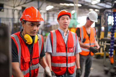 Portrait of male worker standing in the heavy industry manufacturing factory.