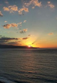 Scenic view of sea at sunset