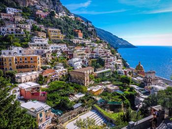 High angle view of townscape by sea