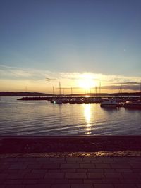 View of harbor against sky during sunset