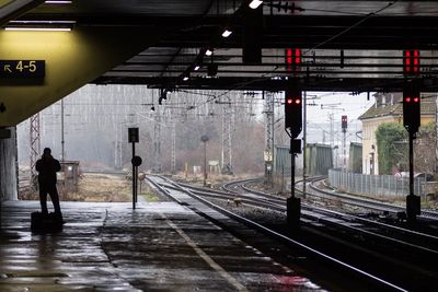 Man walking on railroad station platform