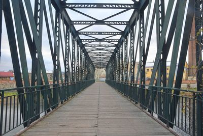 Old metal overpass, bridge over the river. rivet metal bridge in town breclav, czechia.