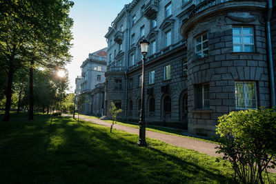 Buildings in city against clear sky