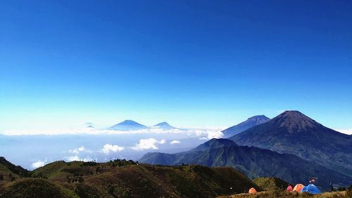 Scenic view of mountains against clear blue sky