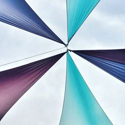 Low angle view of fabric decoration against sky
