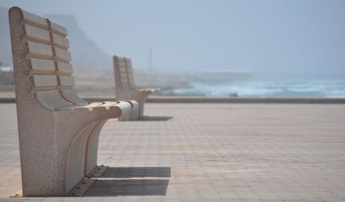 Close-up of beach against sky