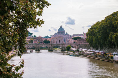 River amidst buildings against sky