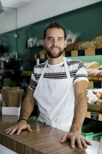 Portrait of smiling male entrepreneur in bakery