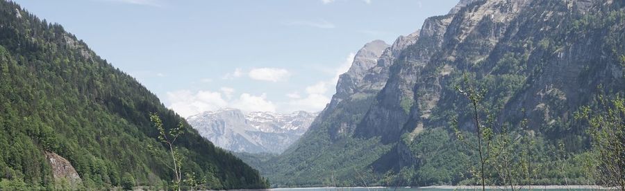 Panoramic view of rocky mountains against sky