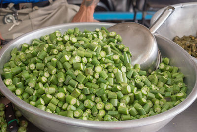 Close-up of chopped okra in container for safe