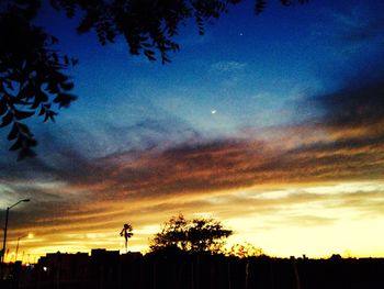 Low angle view of cloudy sky at sunset