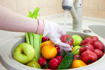 Washing fruits and vegetables after shopping from grocery store during coronavirus covid-19