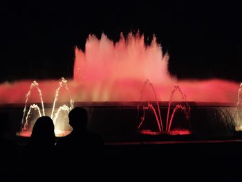 Silhouette of woman at night