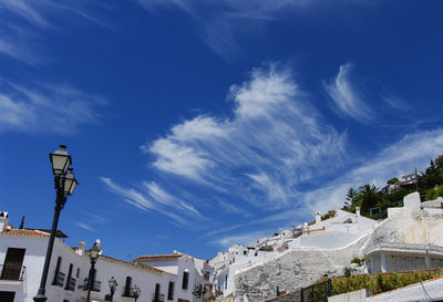 Low angle view of buildings against blue sky