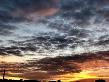 Low angle view of dramatic sky during sunset