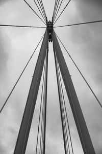 Low angle view of suspension bridge against sky