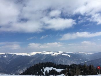 Scenic view of snowcapped mountains against sky