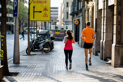 Women walking on street in city