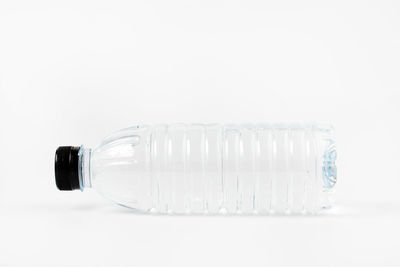 Close-up of wineglass against white background