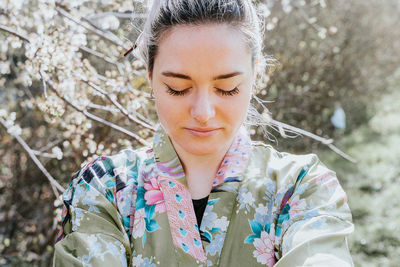 Portrait of young woman with eyes closed