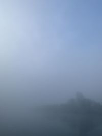 Scenic view of foggy landscape