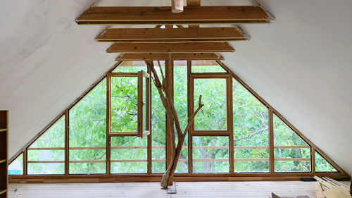 Low angle view of building seen through window