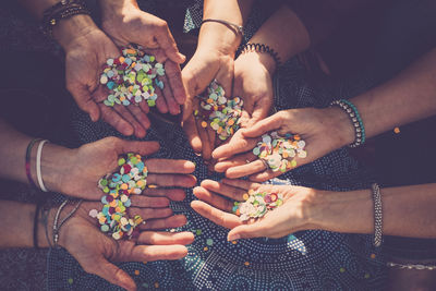 High angle view of people holding hands