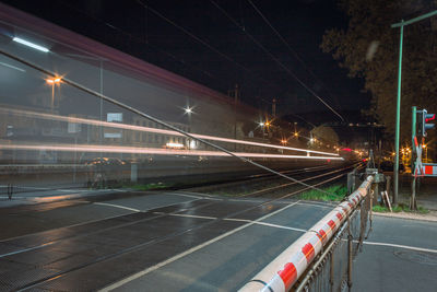 Light trails on road in city at night