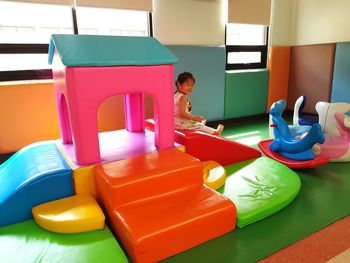 Midsection of man with toy sitting on seat