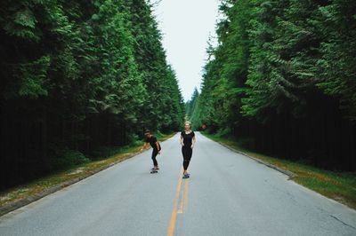 Woman walking on road