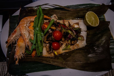 High angle view of fish in plate on table